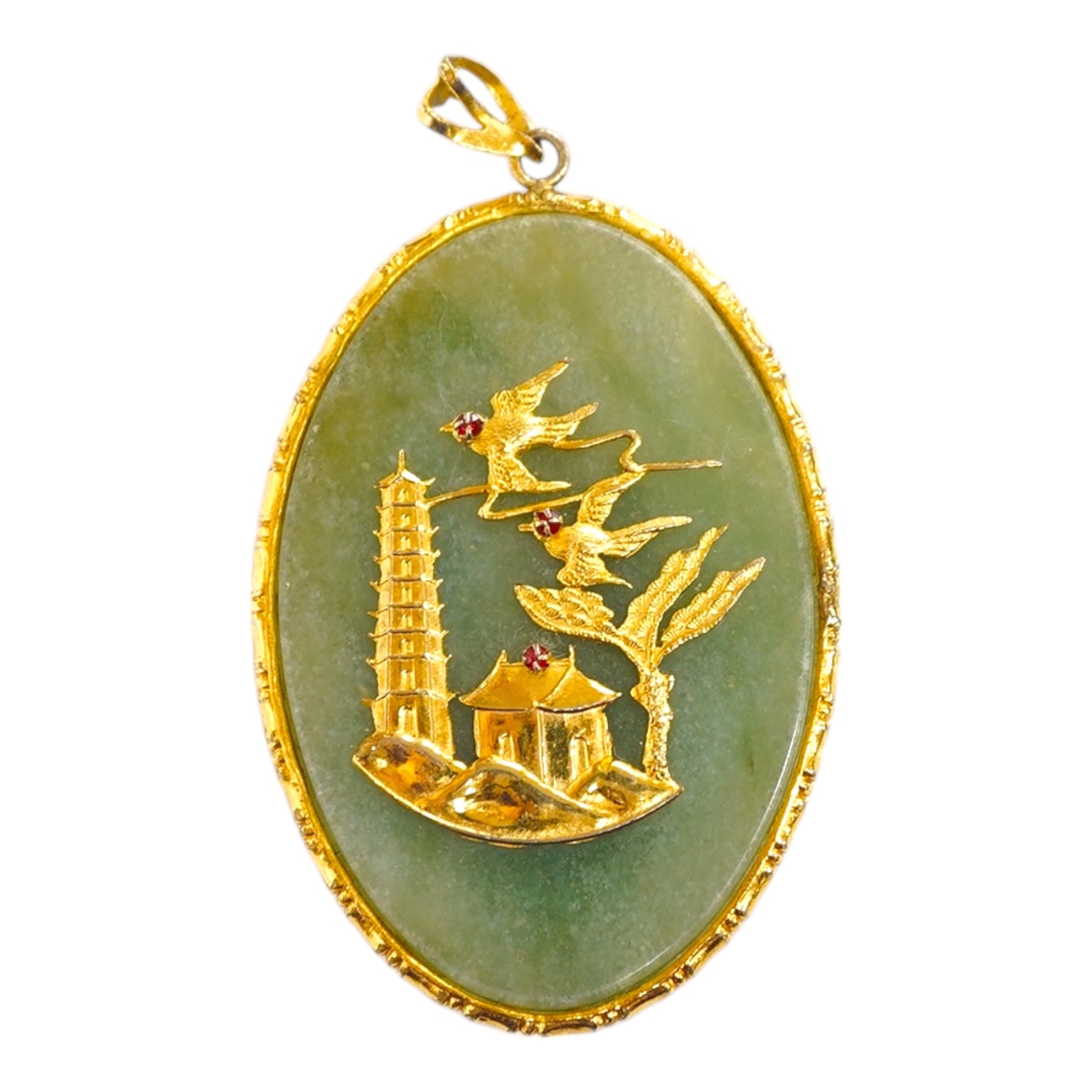 A gilt metal mounted Chinese hardstone pendant. Condition - fair to good